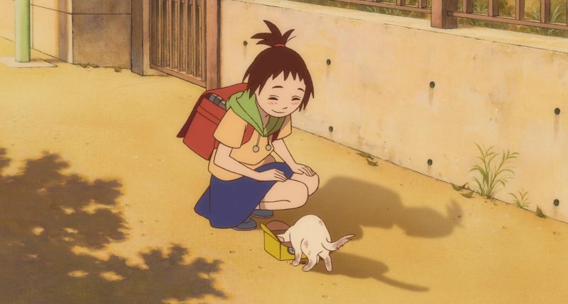 Cô bé Haru thuở nhỏ cho một chú mèo lấm lem ăn